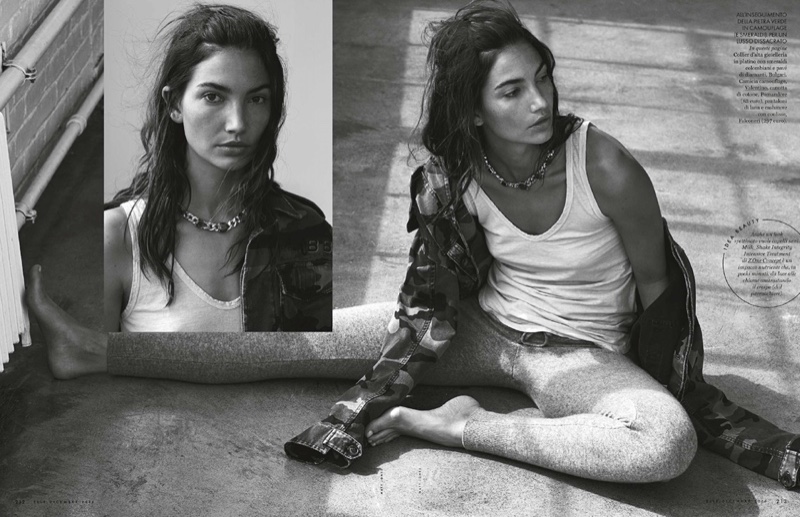 Posing on the floor, Lily Aldridge wears Valentino camouflage shirt with Pomandere shirt and Falconeri pants