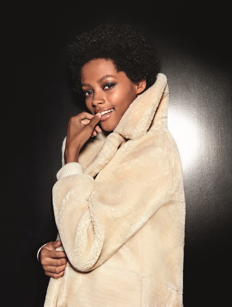 Londone Myers models faux fur jacket in Topshop's holiday 2016 campaign