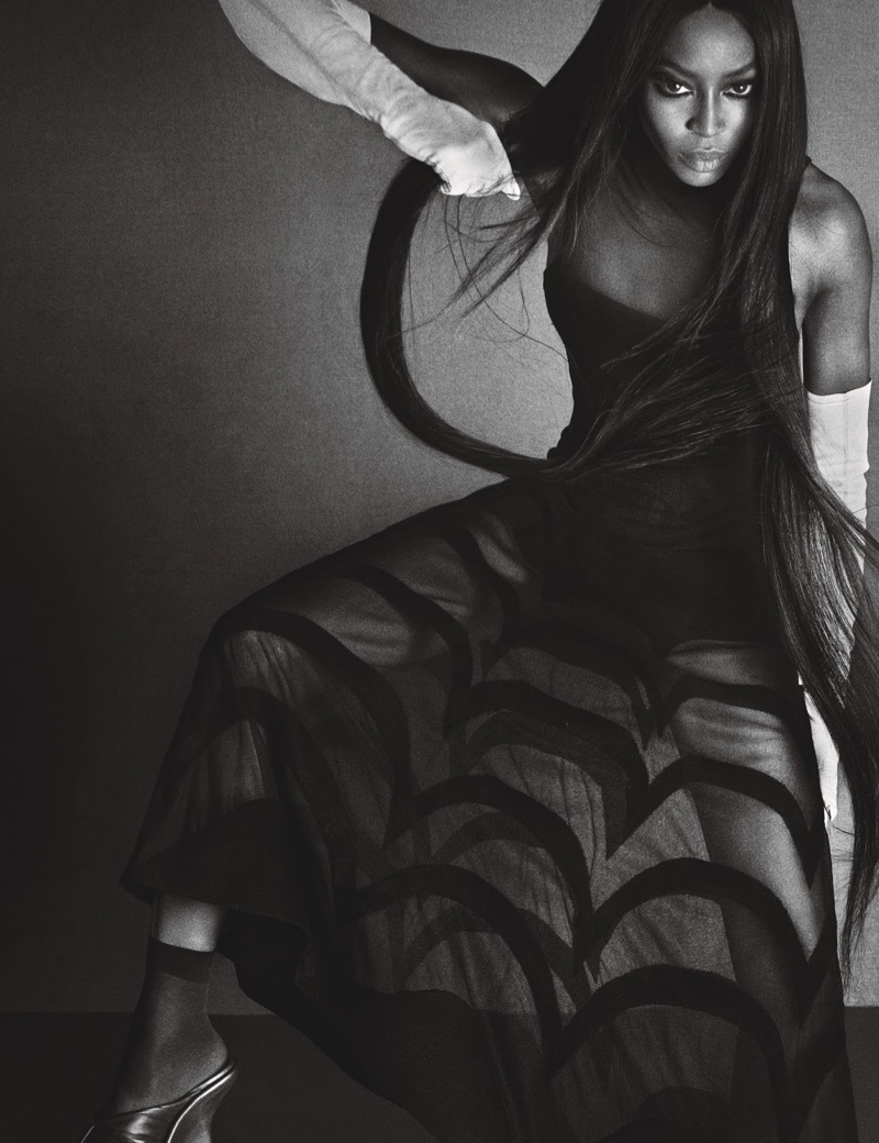 Serving a fierce look, Naomi Campbell wears Azzedine Alaïa dress, Gaspar Gloves and Balenciaga shoes