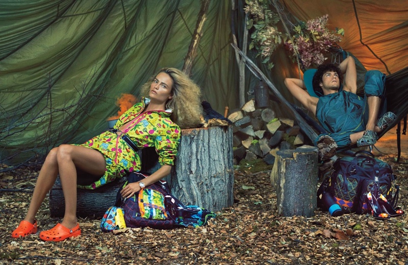 Natasha Poly lounges in Prada printed dres