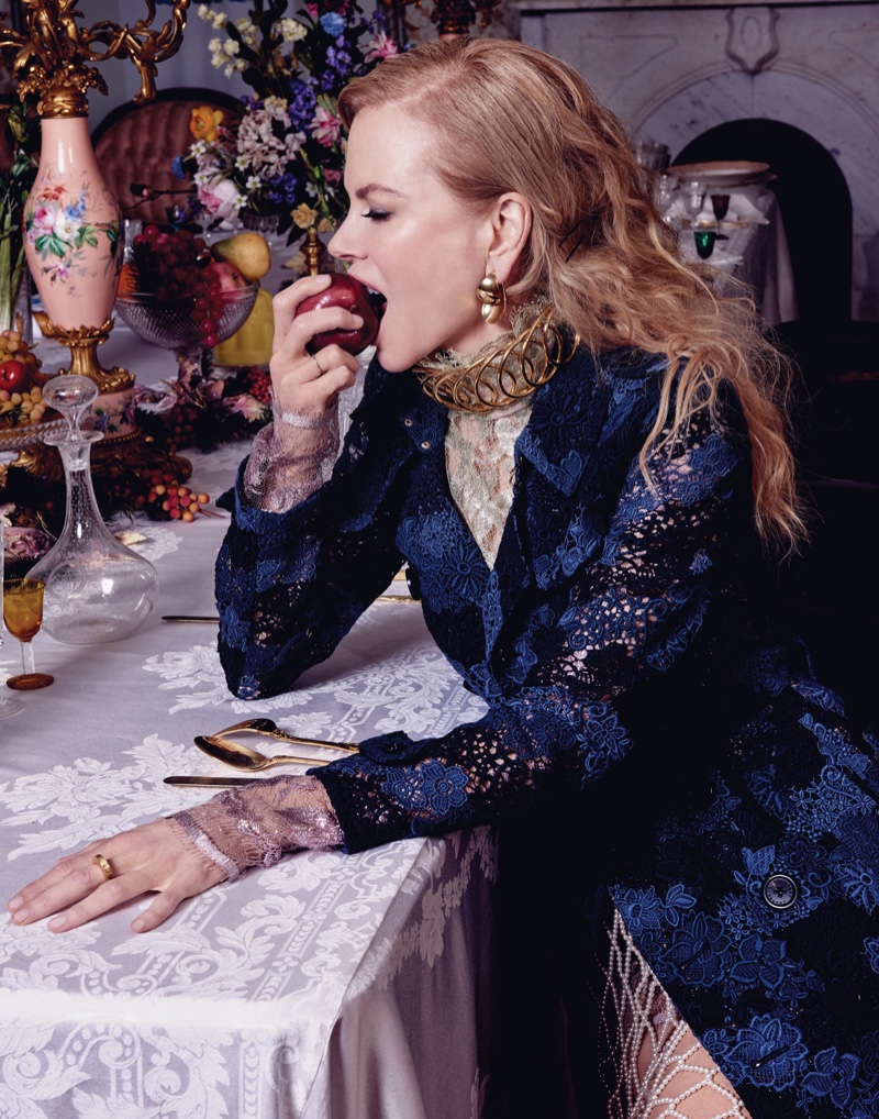 Taking a bite out of an apple, Nicole Kidman wears Burberry coat, Lanvin top and Dries van Noten skirt