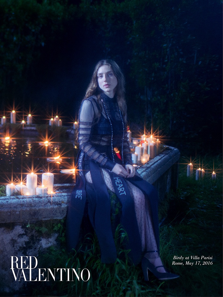 Surrounded by candle light, Birdy stars in Red Valentino's fall 2016 advertising campaign
