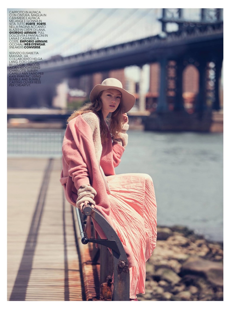 The model embraces pastels in Alpaca coat, knit cashmere sweater and silk skirt from Forte Forte