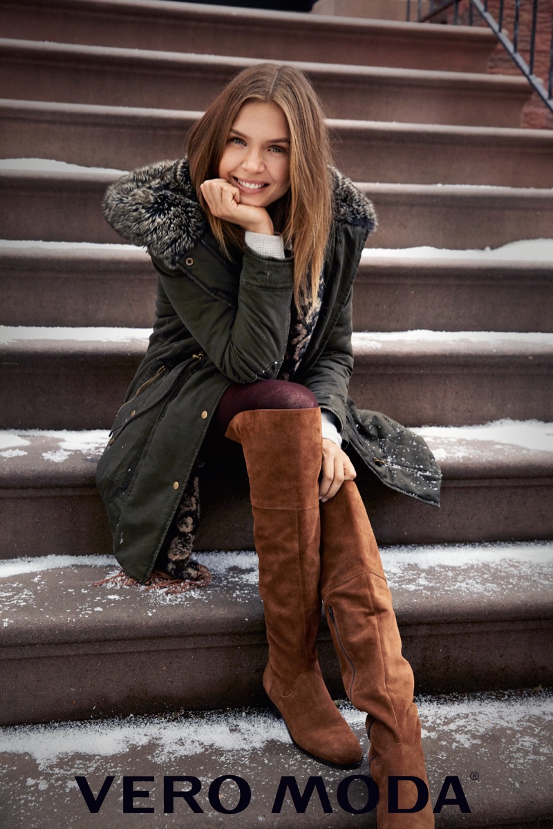 Posing on steps, Josephine Skriver covers up in a fur trimmed parka from Vero Moda