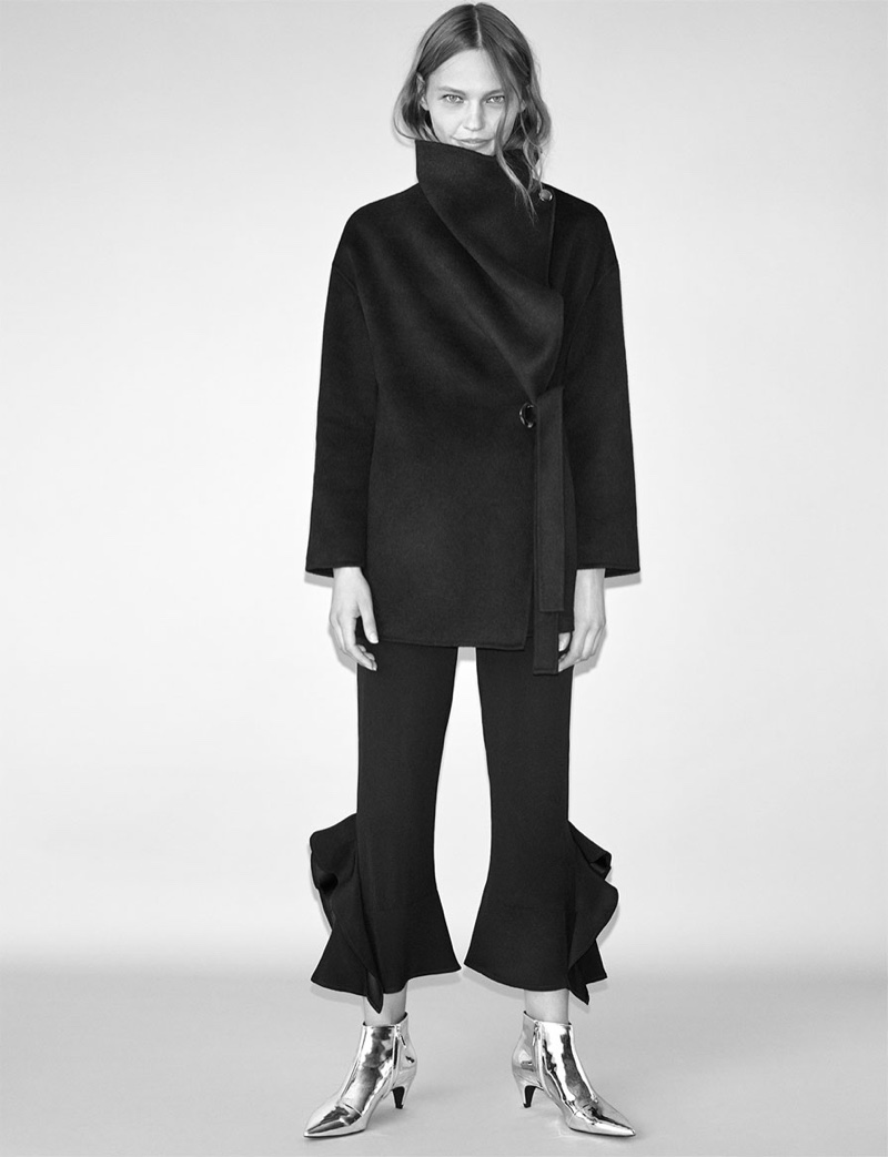Embracing large proportions, Zara features oversized wrap coat with fared flowing trousers