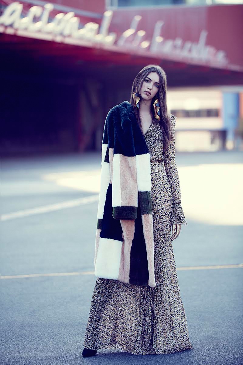 Looking bohemian chic, the model wears Ermanno Scervino dress, Cacharel coat and Emanuel Ungaro boots