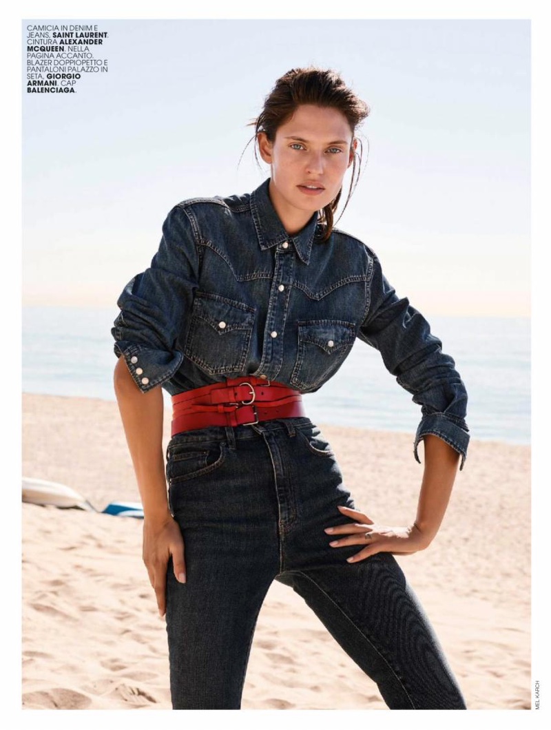 Bianca Balti models Saint Laurent denim shirt and jeans with Alexander McQueen belt