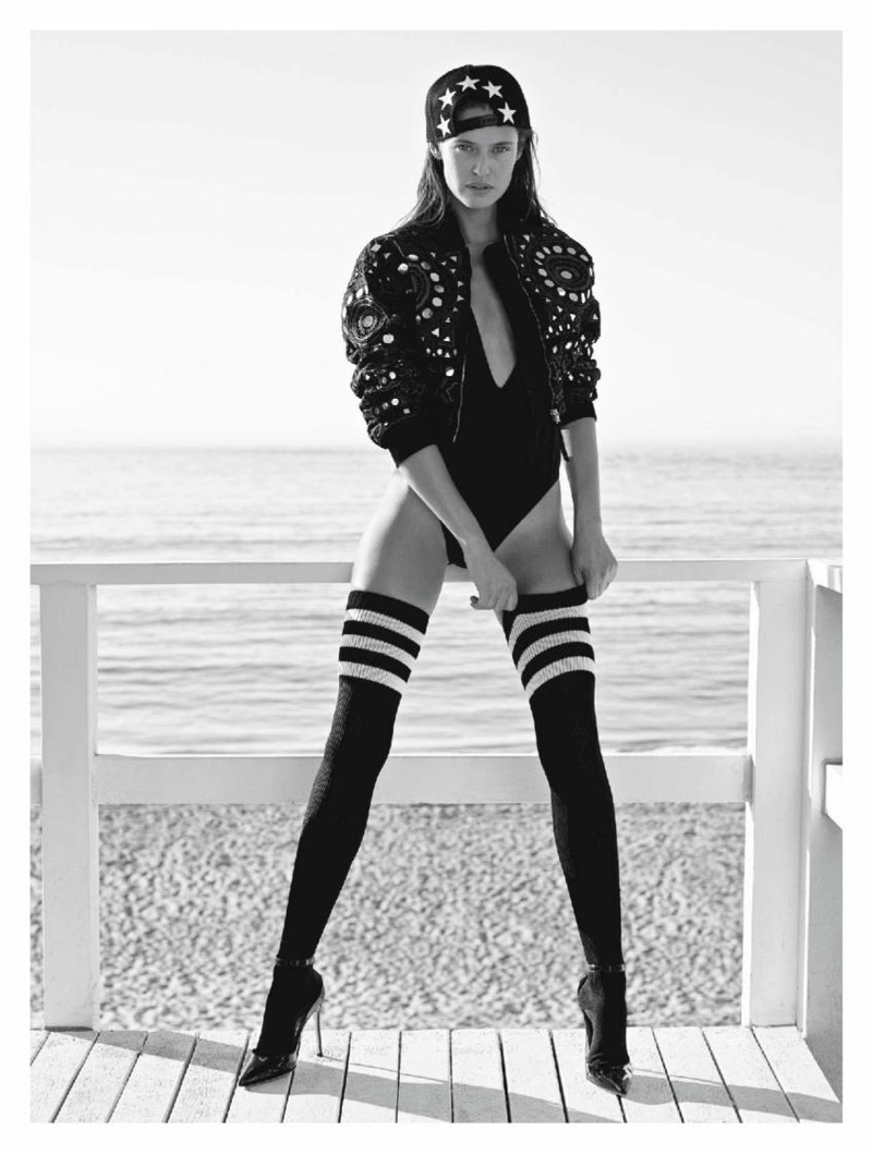 Bianca Balti models Moschino bomber jacket, American Apparel bodysuit, Givenchy cap and Gianvito Rossi heels