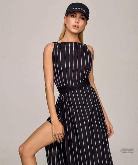 Hailey Baldwin Sports the Resort Collections for Harper's Bazaar Spain Getting sporty, Hailey Baldwin wears Balenciaga baseball cap and striped dress
