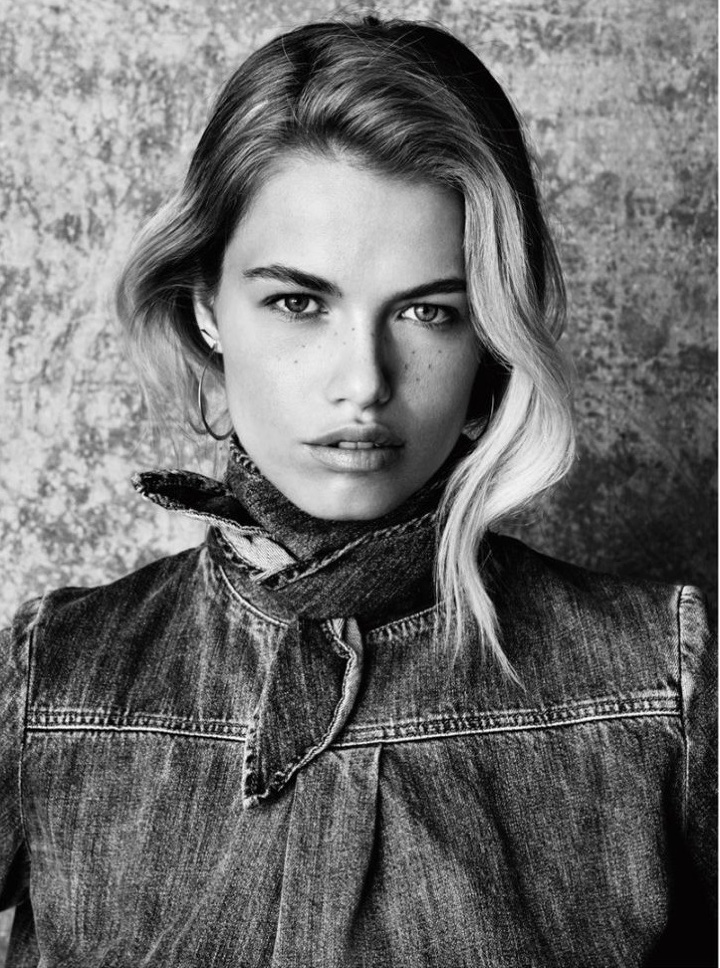 Hailey Clauson shows off her freckles in Chloe denim top and Aoko Su earrings