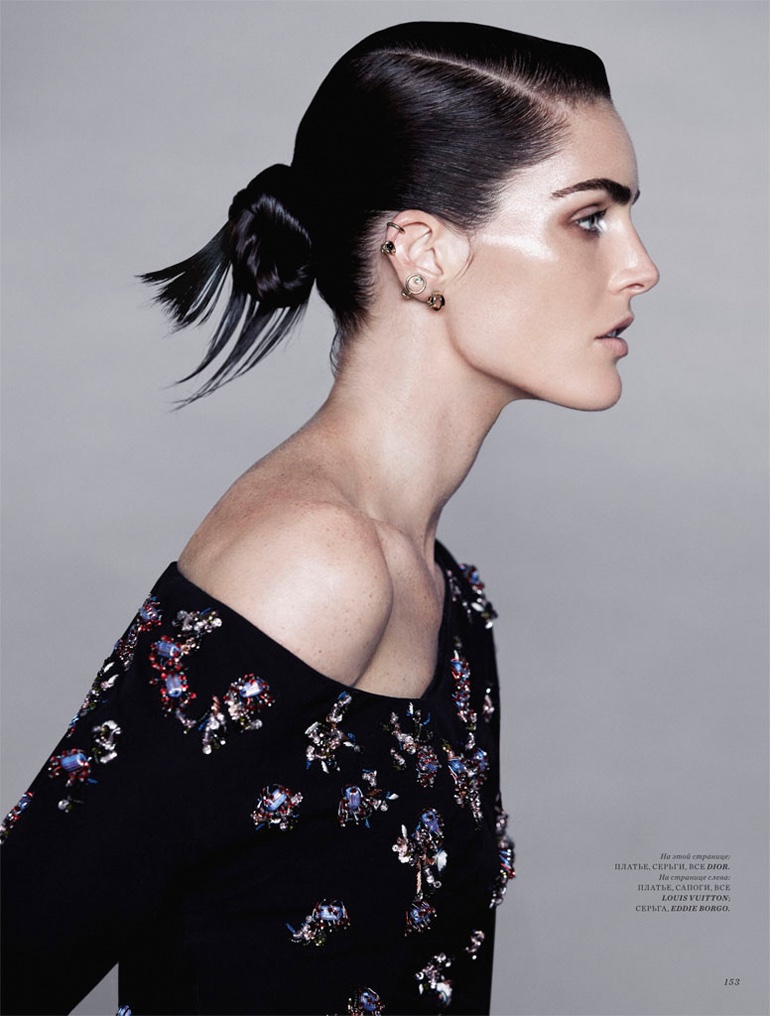 Wearing a sleek updo hairstyle, Hilary Rhoda models embellished top from Dior