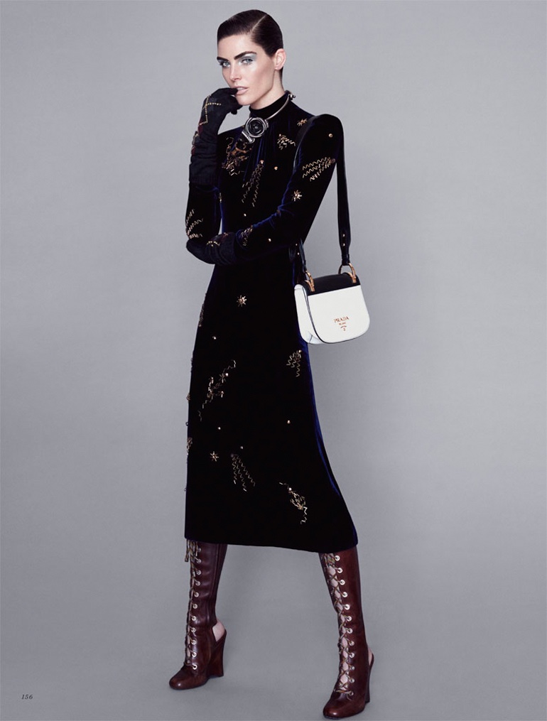 Model Hilary Rhoda wears embroidered Prada velvet dress, bag and boots