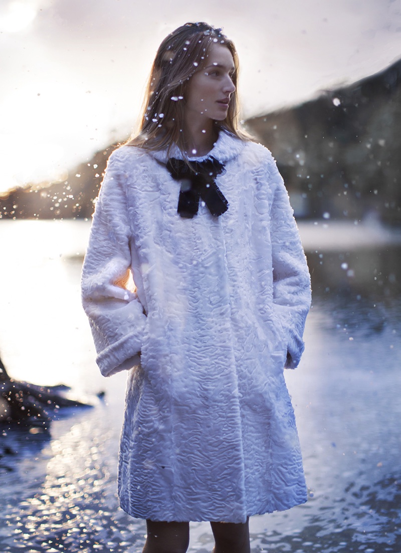 Underneath the snow, Josephine le Tutour wears Gucci silk jacquard coat