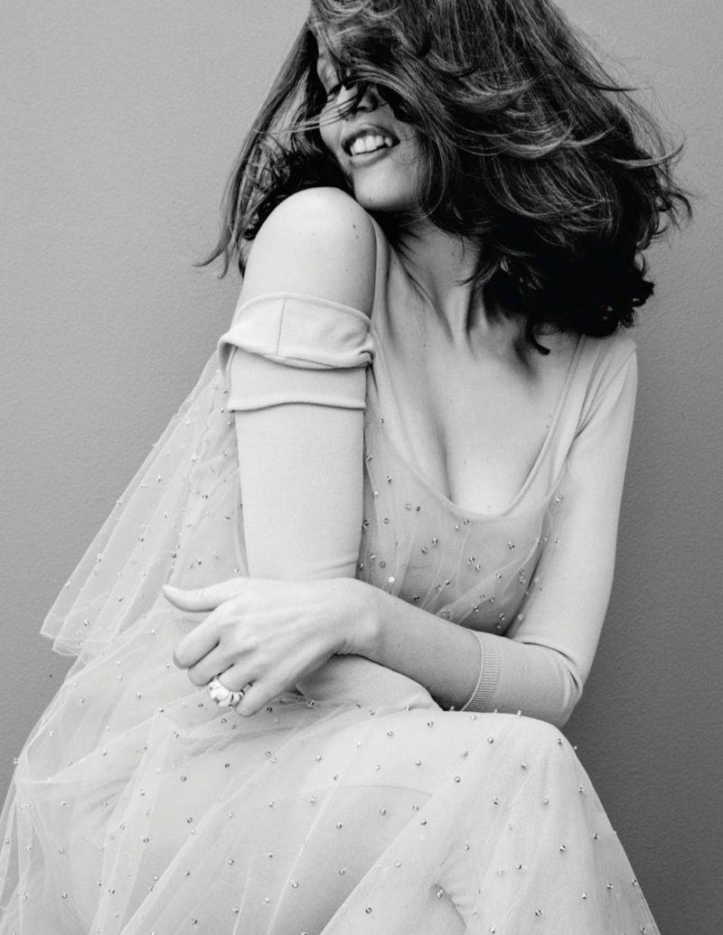 Photographed in black and white, Laetitia Casta models Valentino dress