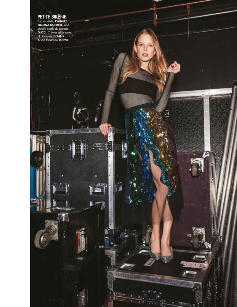 Turning on the shine factor, Lina Berg poses in Twinset sheer top with Gucci sequined skirt and LOEWE pumps