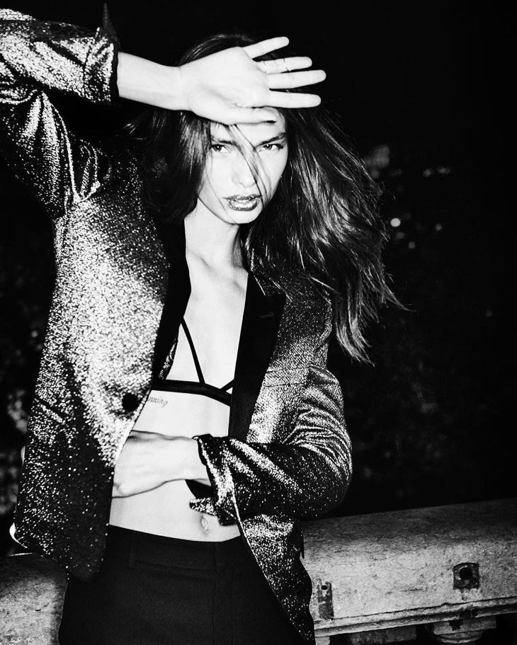 Luma Grothe wears metallic blazer in this black and white image