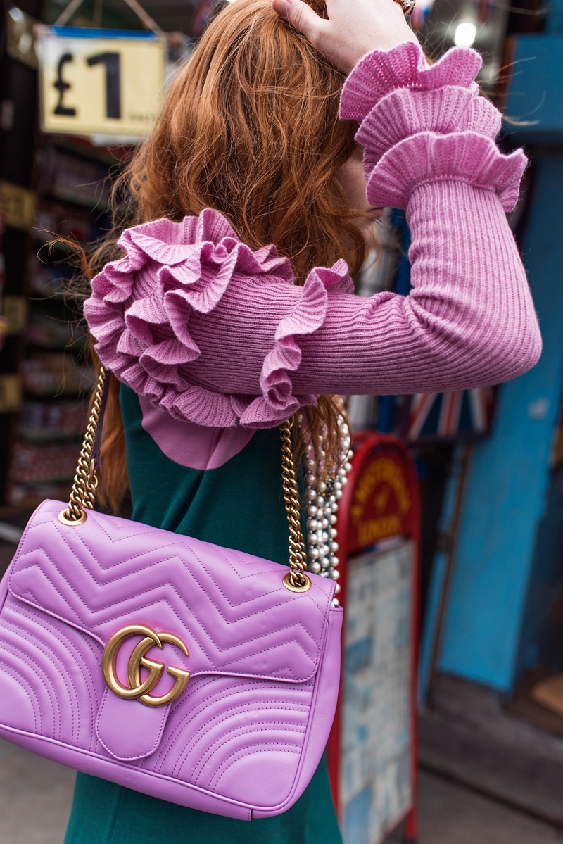 Madison Stubbington shows off an embroidered Gucci bag in the fashion shoot