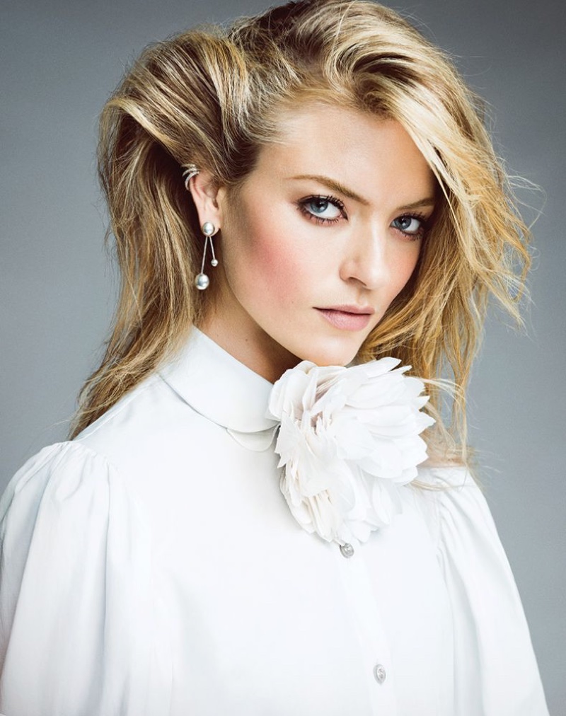 Model Martha Hunt poses with messy hairstyle and high-collared blouse