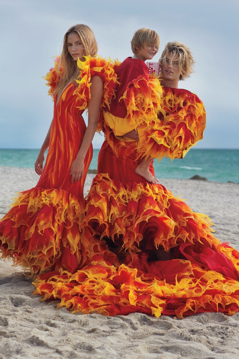 Posing on the beach with Jordan Barrett, Natasha Poly wears Juan Gatti costume