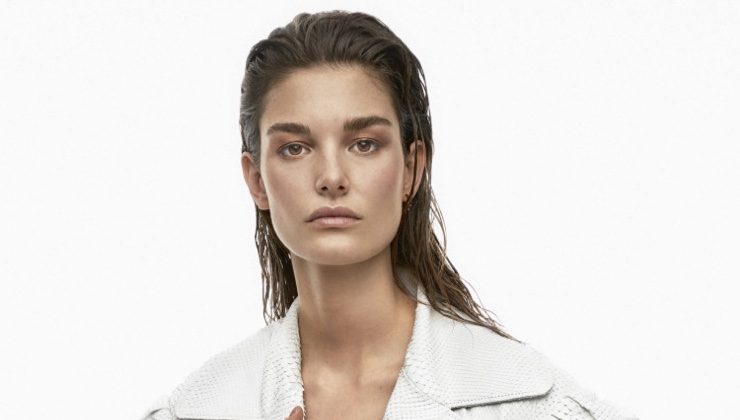 Ophelie Guillermand covers up in white Gucci python trench coat