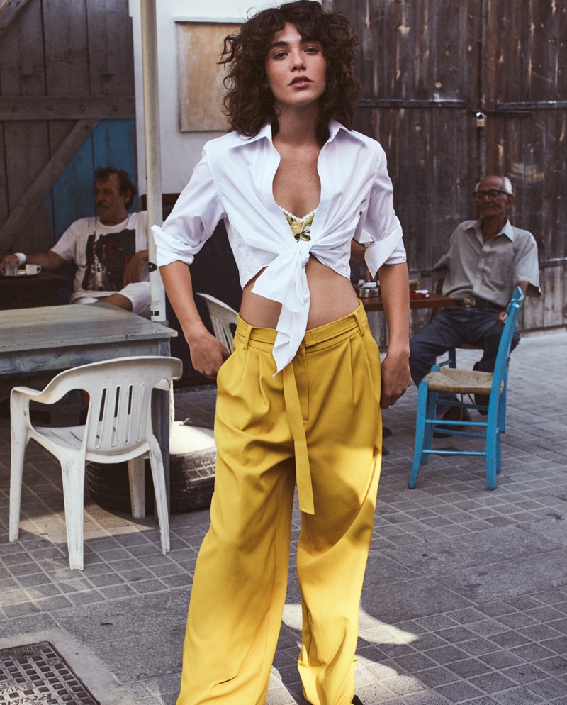 Model Steffy Argelich wears Johanna Ortiz shirt, Miguelina bra and Tibi pants