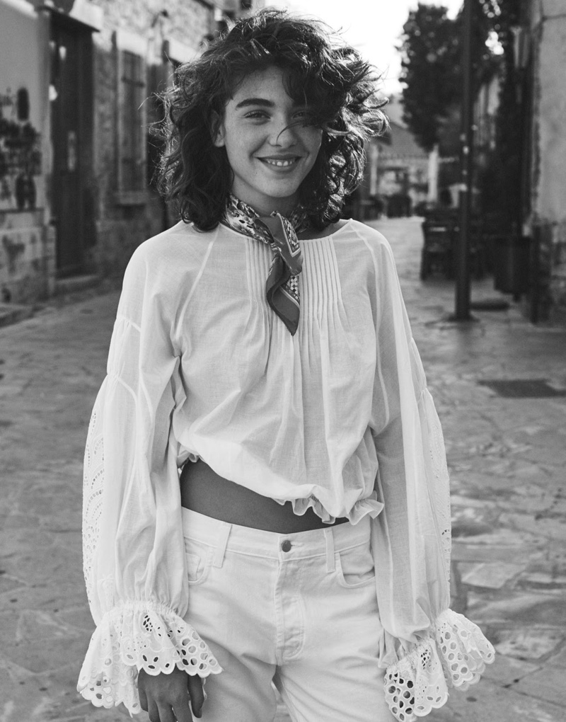Flashing a smile, Steffy Argelich models Chloe top, J Brand jeans with Dolce & Gabbana scarf