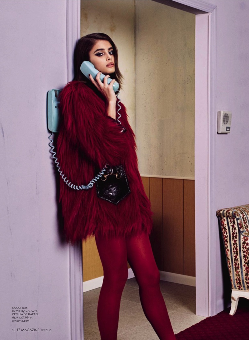 Posing on the phone, Taylor Hill wears Gucci fur coat with Cecilia de Rafael tights
