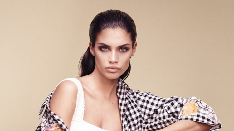 Model Sara Sampaio wears gingham and floral print coat from Blumarine’s spring 2017 collection