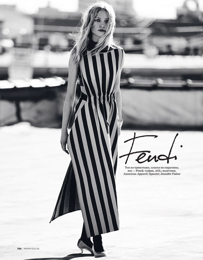 The model poses in striped Fendi dress with AGL heels
