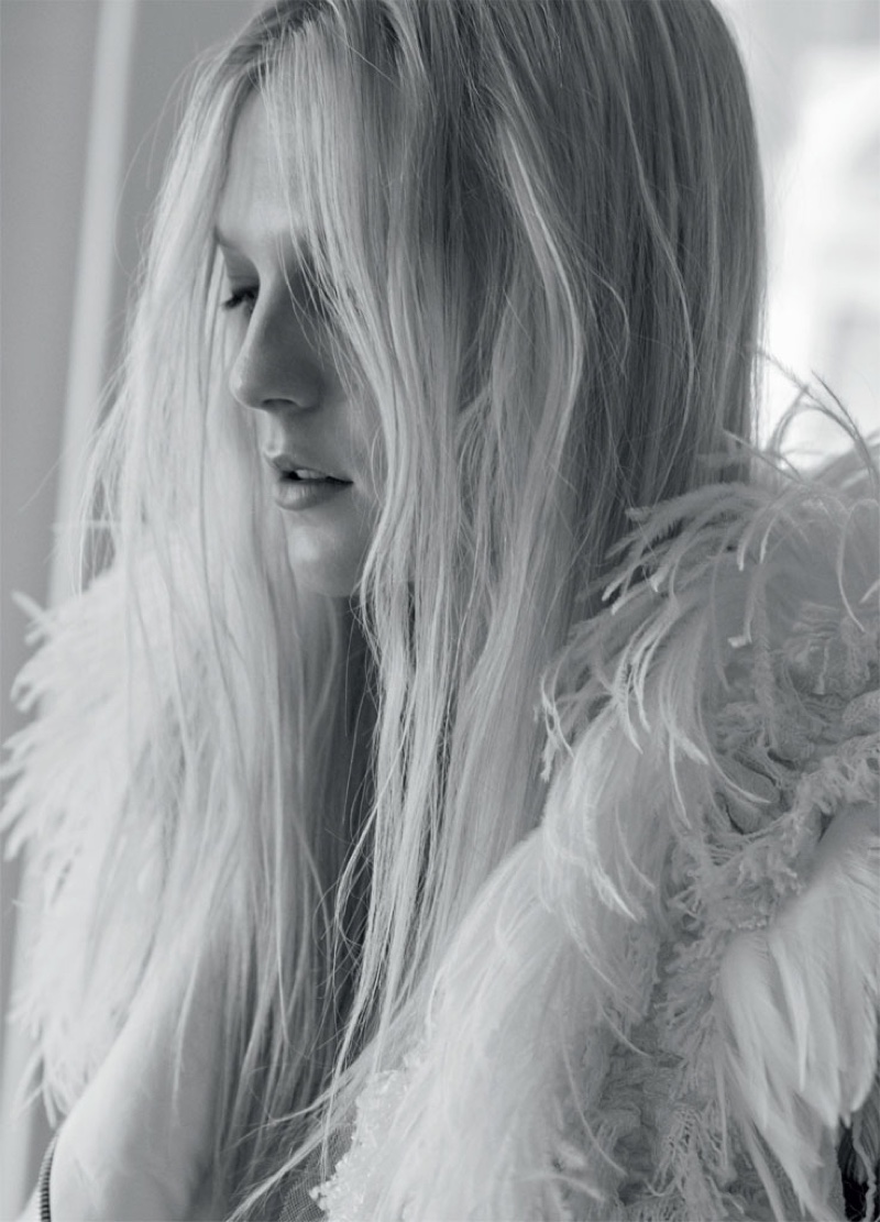 Model Emilie Evander gets her closeup in Lanvin tweed and feather jacket