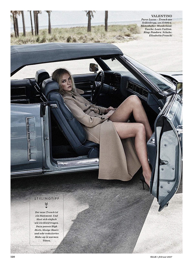 Posing in a car, Heather Marks wears Valentino trench coat and Elisabetta Franchi heels