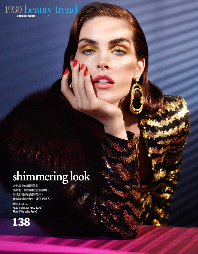 Shining in gold, Hilary Rhoda wears gold eyeshadow and lacquered manicure