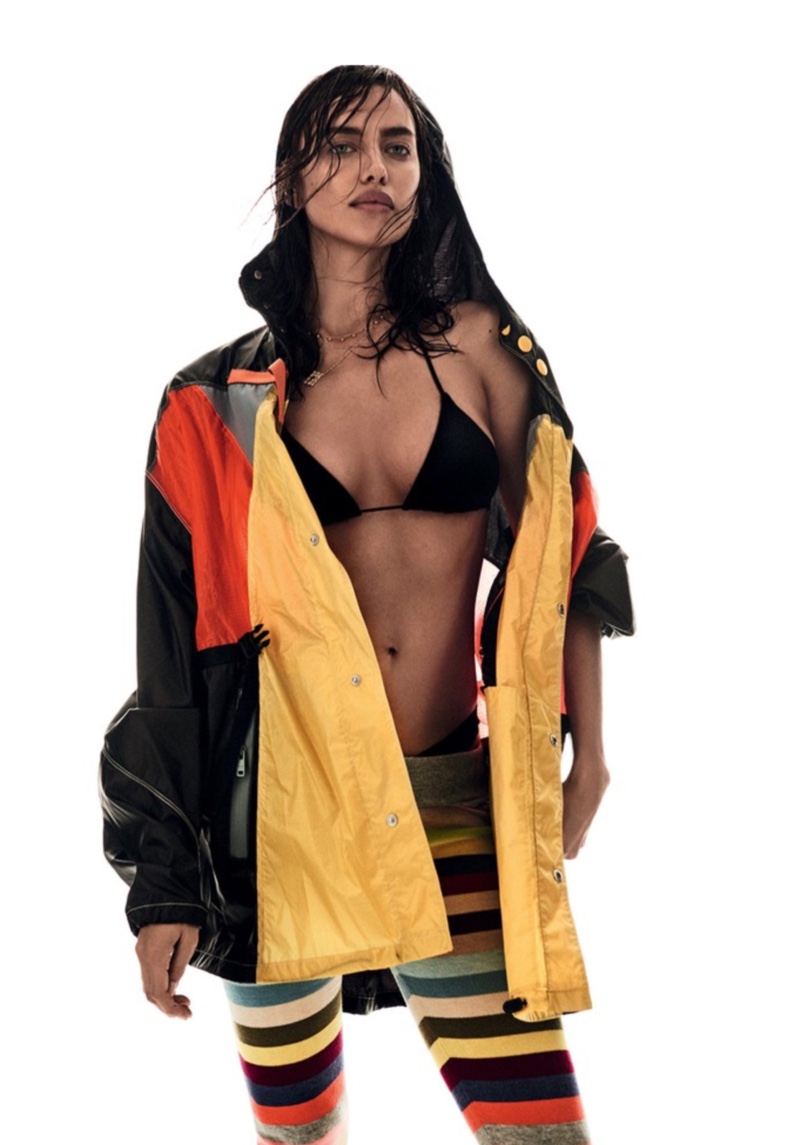 Irina Shayk models multi-colored windbreaker and striped leggings