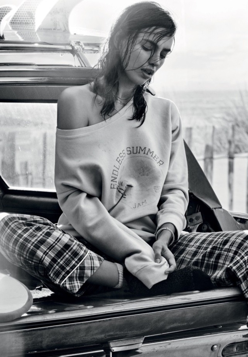 Model Irina Shayk wears graphic sweatshirt with plaid pants