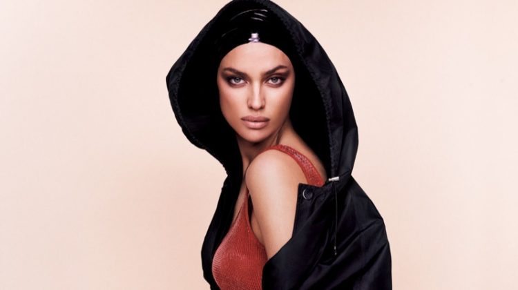 Model Irina Shayk flaunts some leg in hooded parka and knit bodysuit