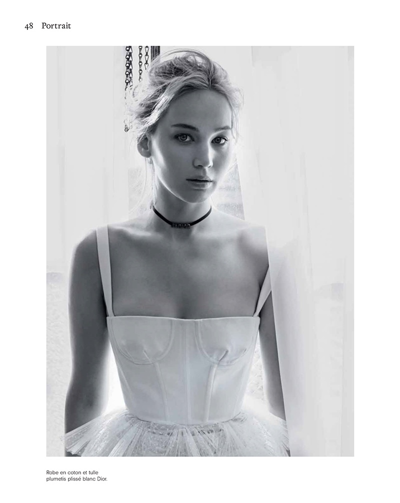 Actress Jennifer Lawrence poses in Dior dress with tulle skirt