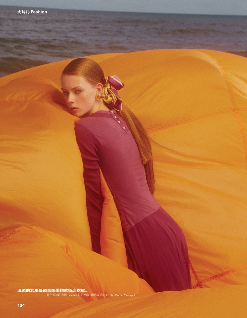 Model Lauren de Graaf poses in Loewe dress with Emilio Pucci scarf