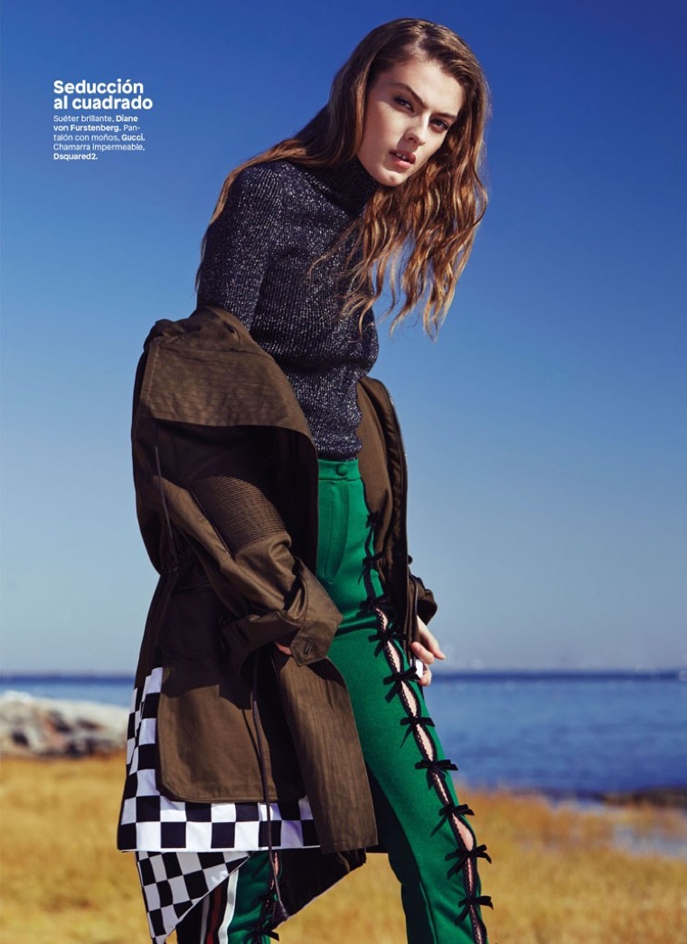 The model poses in Diane von Furstenberg sweater with Gucci pants and DSquared2 coat