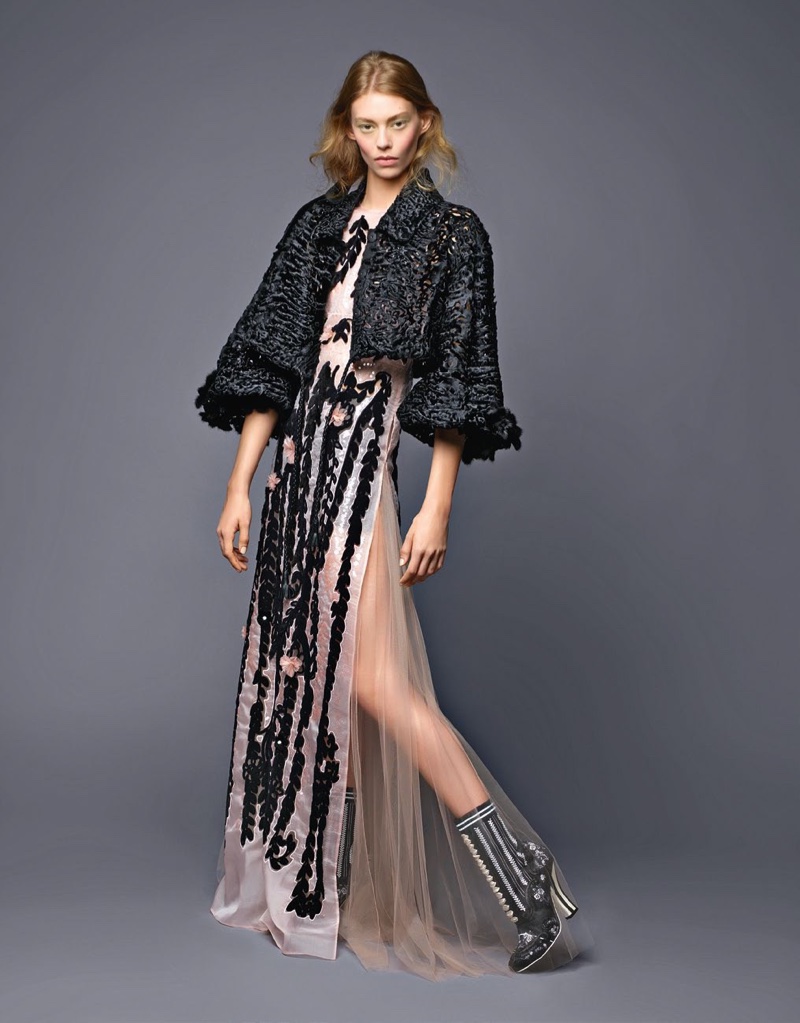 Ondria Hardin wears embroidered jacket and sheer appliqué gown