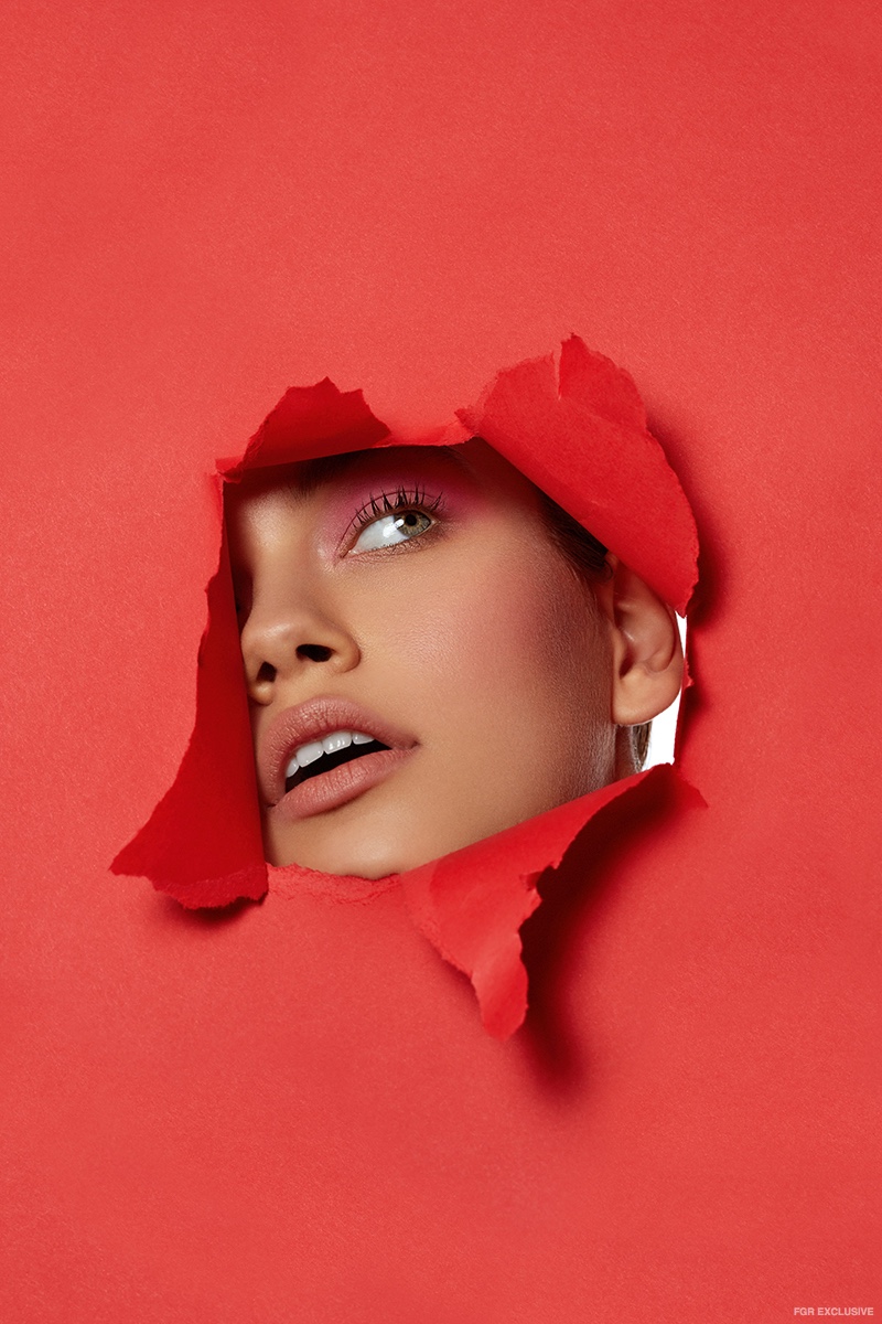 A peek of pink shines through a red partition. Photo: Beth Sternbaum