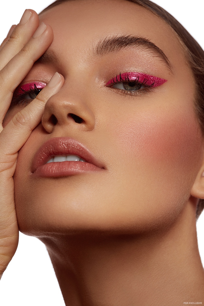 Sophia Tatum wears pink, glittery winged eyeliner