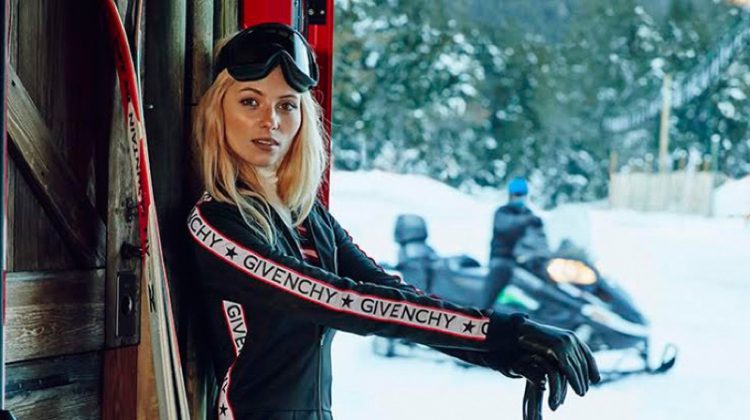 Model Vika Falileeva wears Givenchy ski suit with logos
