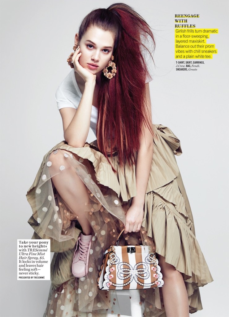 Rocking a high ponytail, Anais Pouliot wears J. Crew t-shirt, skirt and earrings with Fendi bag