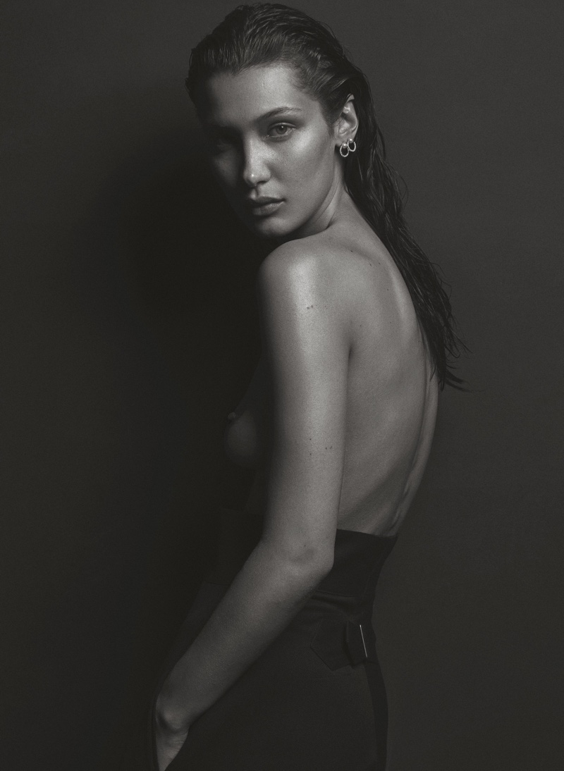 Posing topless, Bella Hadid wears Chloe pants