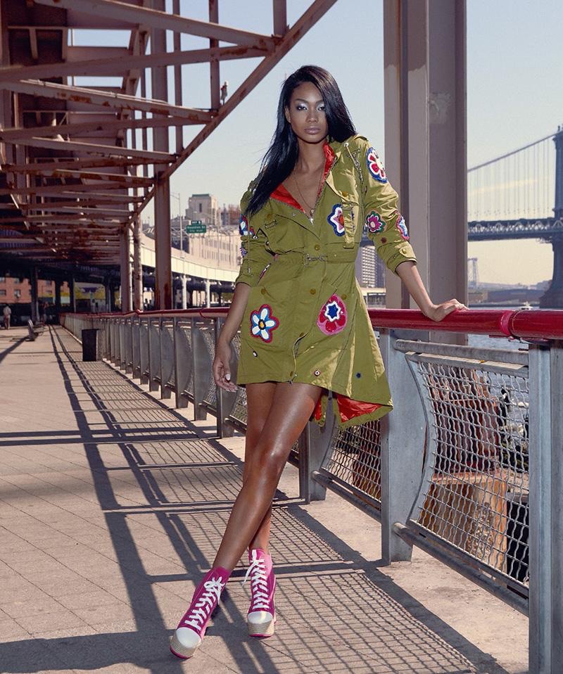 Chanel Iman wears khaki jacket with floral embellishments from Moschino