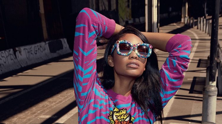 Chanel Iman wears embellished sunglasses and printed dress from Moschino