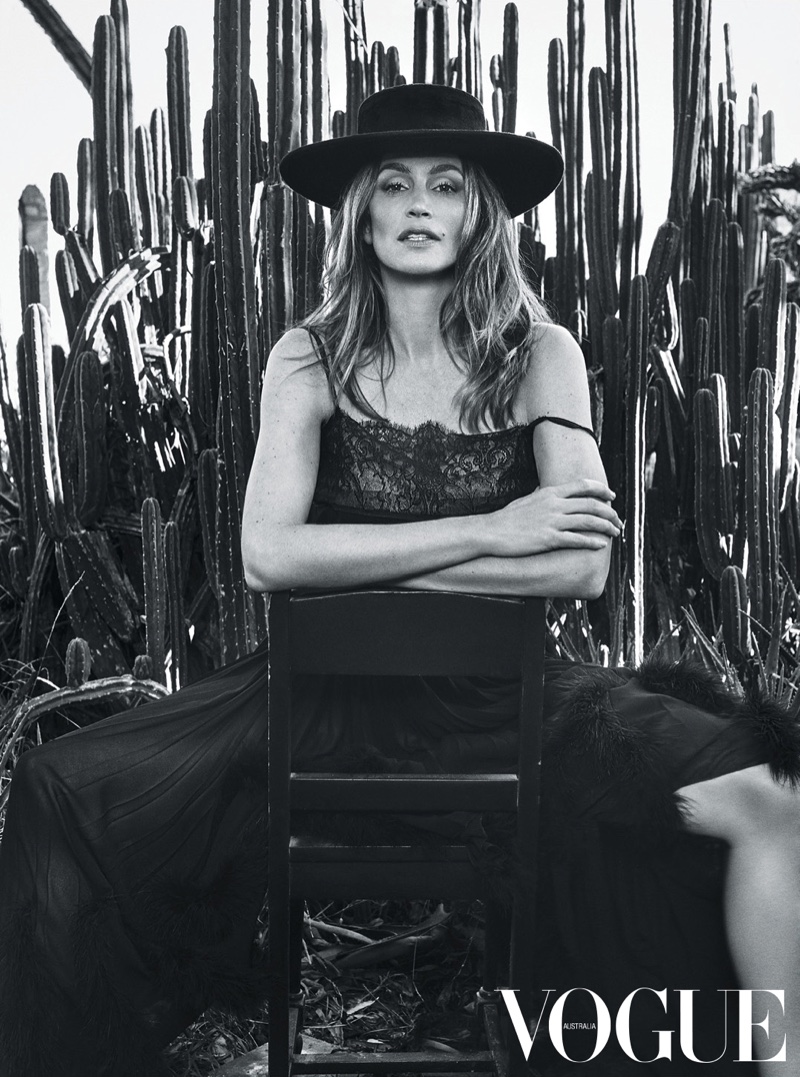 Cindy Crawford poses in Chanel dress with wide-brimmed hat