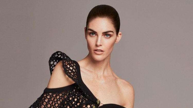 Hilary Rhoda wears sculpted top and high-waisted trousers