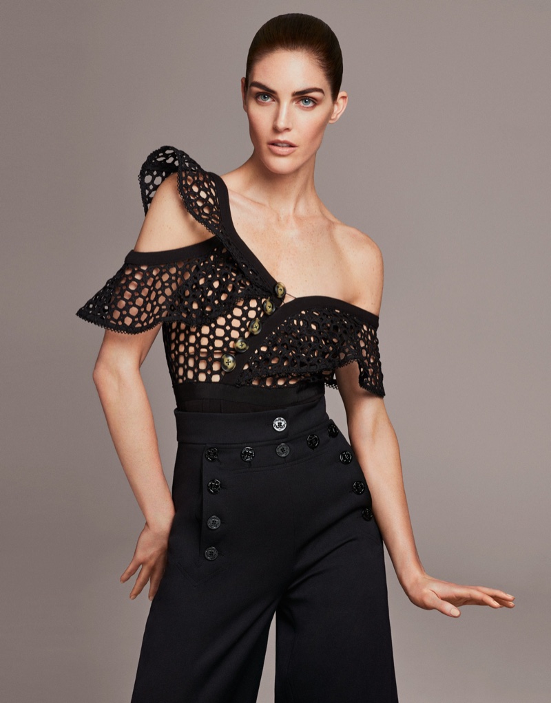 Hilary Rhoda wears sculpted top and high-waisted trousers