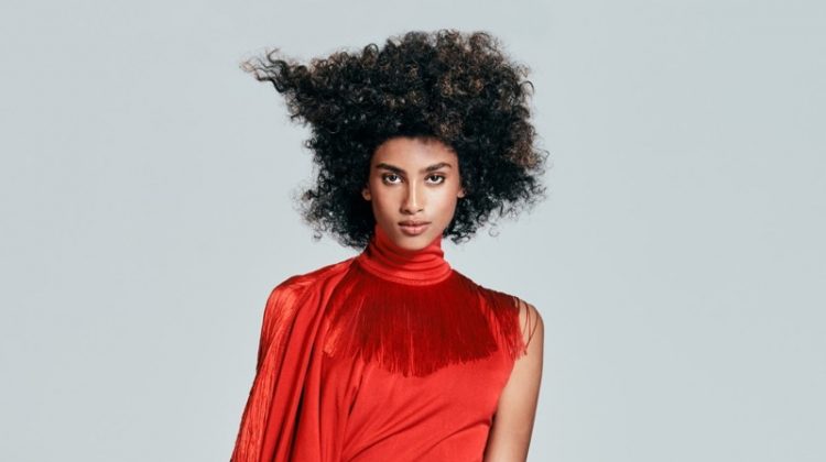 Embracing fringe, Imaan Hammam poses in Givenchy dress with Falke tights